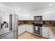 Bright kitchen featuring stainless steel appliances and granite countertops at 1309 Nokomis S Ave, Venice, FL 34285