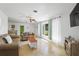 Inviting living area with comfortable seating and a sunlit view at 1309 Nokomis S Ave, Venice, FL 34285