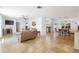 Open-concept space with living and dining areas, featuring tile floors and bright lighting at 1309 Nokomis S Ave, Venice, FL 34285