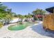 Backyard with a beautiful pool, outdoor shower, and comfortable seating area at 1309 Nokomis S Ave, Venice, FL 34285