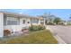 Charming single-story home with well-manicured front yard and covered entrance at 5006 Springwood N Ave # 119, Pinellas Park, FL 33782