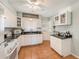 Bright kitchen featuring updated cabinetry, granite counters, and modern appliances at 5006 Springwood N Ave # 119, Pinellas Park, FL 33782