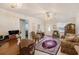 Cozy living room with classic decor, plush furniture and ample natural light at 5006 Springwood N Ave # 119, Pinellas Park, FL 33782