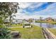 Scenic pond view features lush landscaping, benches, and a tranquil fountain at 5006 Springwood N Ave # 119, Pinellas Park, FL 33782