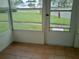 Screened in lanai with tile flooring and views of the front yard and neighborhood at 5006 Springwood N Ave # 119, Pinellas Park, FL 33782