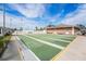 Community shuffleboard courts with an American flag in the background at 5006 Springwood N Ave # 119, Pinellas Park, FL 33782