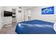 Comfortable bedroom with en-suite bath and view of other living spaces at 6265 Sun Blvd # 101, St Petersburg, FL 33715