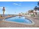 Beautiful community pool with beach access and lounge seating at 6265 Sun Blvd # 101, St Petersburg, FL 33715