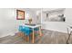 Dining area adjacent to kitchen with seating for four and contemporary decor at 6265 Sun Blvd # 101, St Petersburg, FL 33715