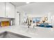 Updated kitchen with water views and open layout to living and dining areas at 6265 Sun Blvd # 101, St Petersburg, FL 33715