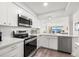 Modern kitchen featuring stainless steel appliances and quartz countertops at 6265 Sun Blvd # 101, St Petersburg, FL 33715