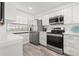 Well-equipped kitchen with stainless steel appliances and ample storage space at 6265 Sun Blvd # 101, St Petersburg, FL 33715