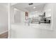 Bright kitchen features white cabinets, stainless steel appliances, and solid surface counters at 6265 Sun Blvd # 101, St Petersburg, FL 33715