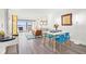 Open-concept living space with water views, modern decor, and a dining area at 6265 Sun Blvd # 101, St Petersburg, FL 33715