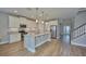 Kitchen with granite countertops, stainless appliances and center island with bar seating at 8044 Lago Mist Way, Wesley Chapel, FL 33545