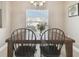 Dining Room area showcasing natural light from window and view of the front yard at 1115 Andrew Aviles Cir, Tampa, FL 33619