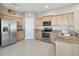 Spacious kitchen featuring stainless steel appliances, granite countertops and ample cabinet space at 1115 Andrew Aviles Cir, Tampa, FL 33619