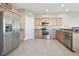 Spacious kitchen featuring stainless steel appliances, granite countertops and ample cabinet space at 1115 Andrew Aviles Cir, Tampa, FL 33619