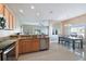 Open floorplan showcasing updated living room, dining room and modern kitchen with granite countertops at 1115 Andrew Aviles Cir, Tampa, FL 33619