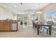 Open floorplan showcasing updated living room, dining room and modern kitchen with granite countertops at 1115 Andrew Aviles Cir, Tampa, FL 33619