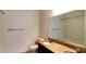 Well-lit bathroom with granite countertops, double sinks, and a shower-tub combination at 1275 Drew St, Clearwater, FL 33755