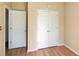 Bedroom with doors and closet space offering ample storage at 1275 Drew St, Clearwater, FL 33755