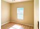 Cozy bedroom with a large window offering natural light and classic ceiling fan at 1275 Drew St, Clearwater, FL 33755