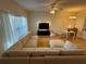 Spacious living room boasts a large sectional sofa, lots of natural light, and modern finishes at 1275 Drew St, Clearwater, FL 33755
