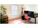 Well-lit home office space with modern desk setup, stylish lighting, and natural accents at 1275 Drew St, Clearwater, FL 33755