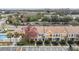 Charming townhomes featuring a neutral color scheme, manicured landscaping, and convenient parking at 1308 Costa Mesa Dr, Wesley Chapel, FL 33543