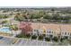 Charming townhomes featuring a neutral color scheme, manicured landscaping, and convenient parking at 1308 Costa Mesa Dr, Wesley Chapel, FL 33543
