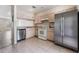 An eat-in kitchen with stainless steel refrigerator, white appliances, and tile flooring at 1308 Costa Mesa Dr, Wesley Chapel, FL 33543