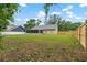 Spacious backyard features green grass and a newly installed wood fence at 13215 Parkhurst Ct, Riverview, FL 33569