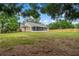 Spacious backyard featuring a screened-in porch and a well-maintained lawn, perfect for outdoor entertaining at 13215 Parkhurst Ct, Riverview, FL 33569