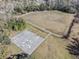 Aerial view of a basketball court and baseball field within a large grassy community space at 13215 Parkhurst Ct, Riverview, FL 33569