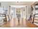 Close-up of the dining area's large bay window with flower centerpiece and classic floors at 13215 Parkhurst Ct, Riverview, FL 33569