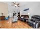 Open living room with vaulted ceilings, stylish parquet floors, and modern ceiling fan at 13215 Parkhurst Ct, Riverview, FL 33569