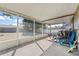 Enclosed patio space offering an outdoor seating area with a view of the backyard at 13215 Parkhurst Ct, Riverview, FL 33569