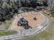 Aerial view of community playground featuring slides, swings, and ample space for children to play and have fun at 13215 Parkhurst Ct, Riverview, FL 33569