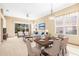 Inviting living and dining area with modern furniture and ample natural light, perfect for gatherings and relaxation at 1330 Misty Greens Dr, Sun City Center, FL 33573
