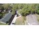 High-angle aerial view of a residential property with a long driveway and surrounding greenery at 205 W Hilda St, Tampa, FL 33603