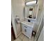 Bathroom featuring a vanity with marble countertop, a framed mirror, and modern fixtures at 2533 Duncan Dr, Belleair Bluffs, FL 33770
