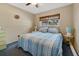 Comfortable bedroom with a queen size bed, neutral walls, and a window offering natural light at 2533 Duncan Dr, Belleair Bluffs, FL 33770