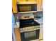 Modern kitchen features stainless steel appliances, including a Frigidaire stove and a built-in microwave at 2533 Duncan Dr, Belleair Bluffs, FL 33770