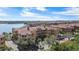 Stunning aerial view of condo community featuring terracotta roofs, manicured landscaping, and waterfront views at 2765 Via Cipriani # 1232B, Clearwater, FL 33764