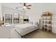 Bedroom featuring a bed with tufted headboard and ample natural light at 2765 Via Cipriani # 1232B, Clearwater, FL 33764