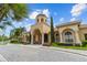 Elegant clubhouse featuring manicured landscaping, a grand entrance, and beautiful architecture at 2765 Via Cipriani # 1232B, Clearwater, FL 33764