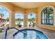 Relaxing hot tub with access to a pool, lounges, and views of the surrounding area at 2765 Via Cipriani # 1232B, Clearwater, FL 33764