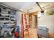 Spacious garage with overhead door and shelving for storage and organization at 3108 Ash Ct, Dunedin, FL 34698