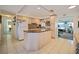 Functional kitchen featuring ample counter space and views into the living area at 3108 Ash Ct, Dunedin, FL 34698